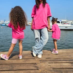 Model and kids wearing oversized pink washed T-shirts – PoshFashion kids casual collection