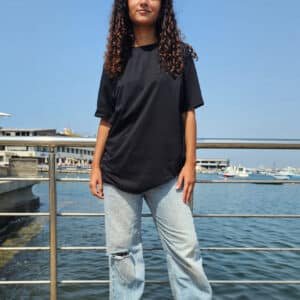 Model wearing regular fit plain black T-shirt – PoshFashion kids & adults matching collection