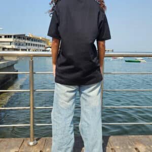 Model wearing regular fit plain black T-shirt – PoshFashion kids & adults matching collection