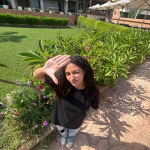 Model wearing regular fit plain black T-shirt – PoshFashion kids & adults matching collection