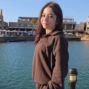 Adult wearing mocha quarter zip French Terry sweatshirt