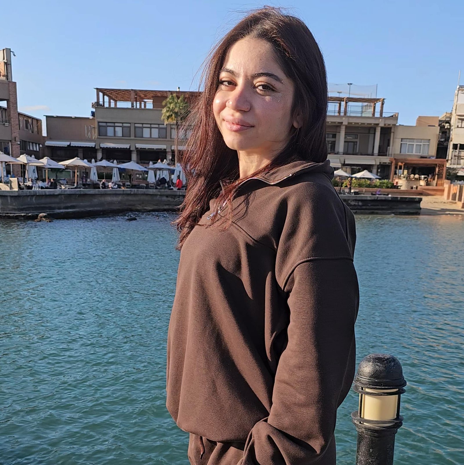 Adult wearing mocha quarter zip French Terry sweatshirt